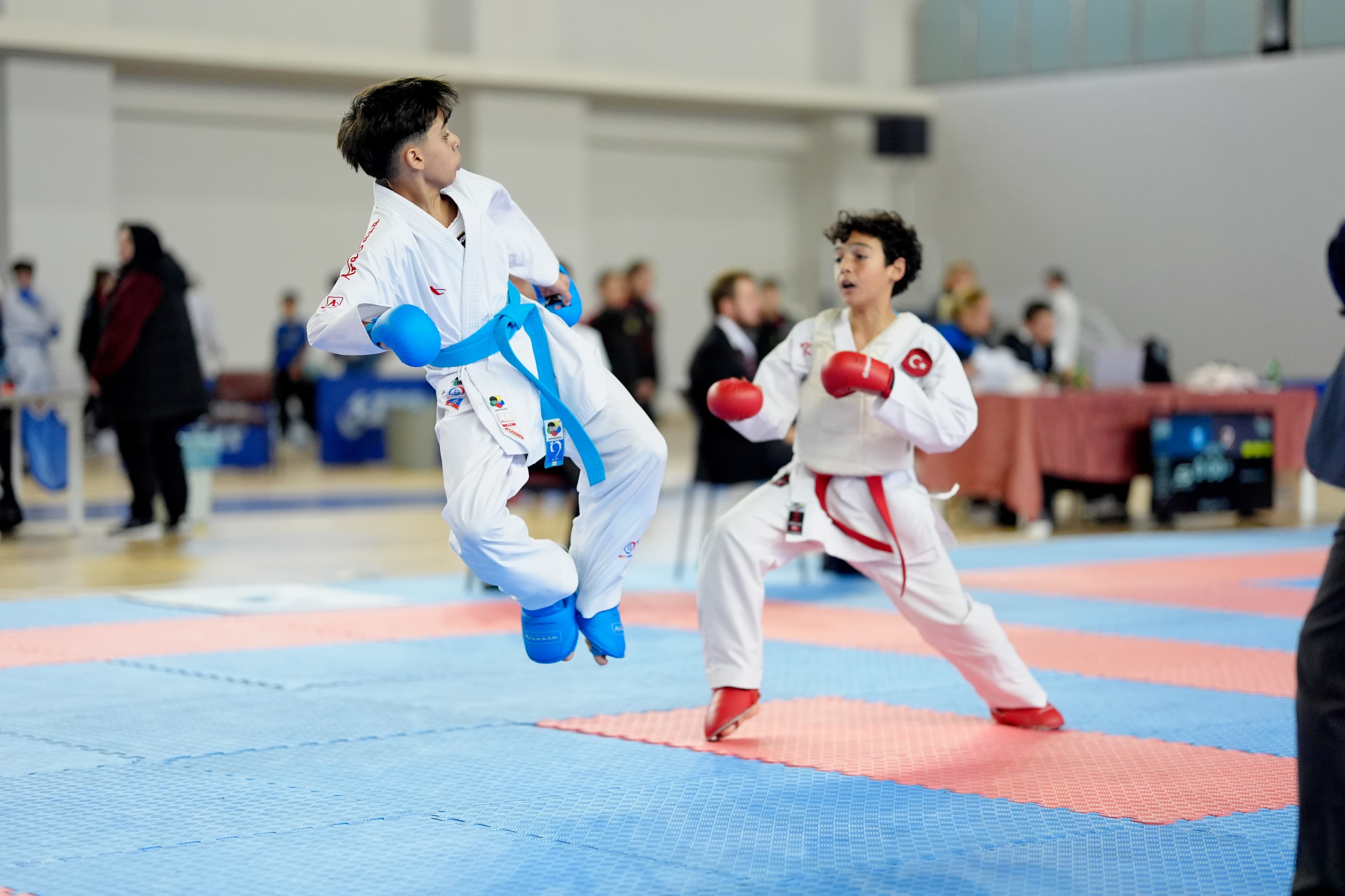 Jumping kick exchange in a kumite match, Dardanelles Cup 2025
